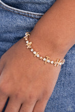 Load image into Gallery viewer, Set in gold square fittings, various multicolored rhinestones gleam around the wrist. Infused along the design, sleek gold letters spell out the word "FAITH" for an inspirational finish. Features an adjustable clasp closure. Due to its prismatic palette, color may vary. Sold as one individual bracelet.