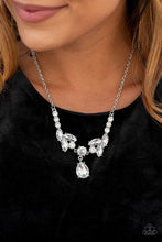 Load image into Gallery viewer, Tiers of white rhinestone encrusted silver frames delicately link below the collar, giving way to an oversized white teardrop rhinestone pendant for a timeless finish. Features an adjustable clasp closure. Includes one pair of matching earrings.