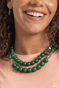 Two strands of oversized emerald green beads featuring a subtle shimmer, silver accents, and clear gray cubed beads stretch around the wrist, creating refined, colorful layers.  The Complete Look! Necklace: "Shopaholic Season - Green"