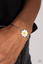 Load image into Gallery viewer, Held together and centered within soft gray cording, a single daisy charm rests. Featuring a silver smiley face in its yellow center, this single flower provides a fashionably, minimalistic statement around the wrist. Features an adjustable sliding knot closure.  Sold as one individual bracelet.
