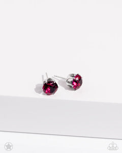 A sparkling fuchsia rhinestone is nestled inside a classic silver frame for a timeless look. Earring attaches to a standard post fitting.  Sold as one pair of post earrings.