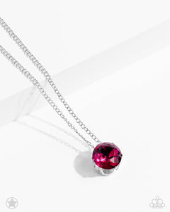 A single fuchsia rhinestone sparkles brilliantly at the bottom of a dainty silver chain, creating a stunning solitaire design. Features an adjustable clasp closure.  Sold as one individual necklace. Includes one pair of matching earrings.