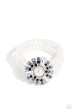 Load image into Gallery viewer, Strung along elastic stretchy bands, three bands of pearls wrap around the wrist. Featured atop the pearly collection, sleek metal bars flare out from a mesmerizing pearl center, creating a stacked blue and white rhinestone-encrusted fringe of fanning frames. A trio of emerald-cut white gem bars are sprinkled across the dazzling display for a sassy finish.
