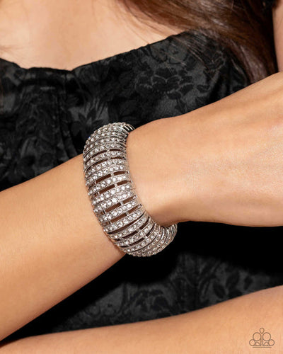 Featuring glistening white gems, trios of curved silver bars join high-sheen curved silver bars for a radiant, light-catching display around the wrist on elastic stretchy bands. Sold as one individual bracelet.