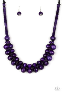Brushed in a distressed finish, vivacious purple wooden beads and discs join below the collar for a summery look. Features a button loop closure.  Sold as one individual necklace. Includes one pair of matching earrings.