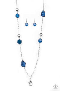 A collection of faceted blue gems, opaque blue beads, and polished silver beads trickle down a shimmery silver chain for a glamorous look. A lobster clasp hangs from the bottom of the design to allow a name badge or other item to be attached. Features an adjustable clasp closure.  Sold as one individual lanyard. Includes one pair of matching earrings.