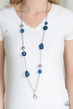 Load image into Gallery viewer, A collection of faceted blue gems, opaque blue beads, and polished silver beads trickle down a shimmery silver chain for a glamorous look. A lobster clasp hangs from the bottom of the design to allow a name badge or other item to be attached. Features an adjustable clasp closure.  Sold as one individual lanyard. Includes one pair of matching earrings.
