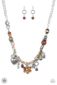 Brown and ivory cording is braided through a chunky silver chain. A unique variety of charms decorate the Blockbuster piece, including a delicate flower and a heart inscribed with the phrase "With All My Heart" on one side and a short bible verse on the other that reads, "Love the Lord thy God with all your heart. Luke 10:27." Features an adjustable clasp closure. Sold as one individual necklace. Includes one pair of matching earrings.