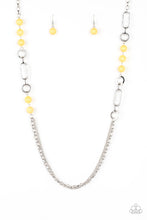 Load image into Gallery viewer, A collection of glassy and polished yellow beads give way to layers of mismatched silver chain for a whimsical look. Features an adjustable clasp closure.  Sold as one individual necklace. Includes one pair of matching earrings.
