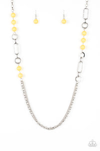 A collection of glassy and polished yellow beads give way to layers of mismatched silver chain for a whimsical look. Features an adjustable clasp closure.  Sold as one individual necklace. Includes one pair of matching earrings.