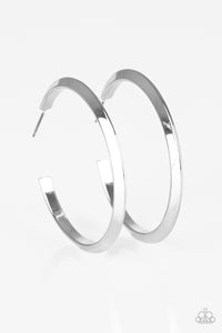 Brushed in a high-sheen finish, a glistening silver hoop curls into a bold ribbed look for a sassy industrial finish. Earring attaches to a standard post fitting. Hoop measures 1 3/4” in diameter.  Sold as one pair of hoop earrings.