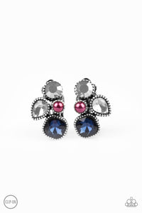 Infused with a dainty purple pearl, mismatched blue, smoky, and hematite rhinestones coalesce into a glittery frame. Earring attaches to a standard clip-on fitting. Sold as one pair of clip-on earrings.