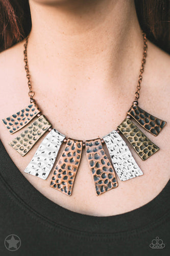Abstract wavy plates of copper, silver, and brass are texturized with eye-catching hammered divots and alternating copper beads along a copper chain. Features an adjustable clasp closure.  Sold as one individual blockbuster necklace. Includes one pair of matching earrings.