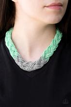 Load image into Gallery viewer, Strands of green seed beads create an indigenous braid below the collar. The green seed beads gradually morph into metallic silver beads at the center for a chic contrasting look. Features an adjustable clasp closure.  Sold as one individual necklace. Includes one pair of matching earrings.
