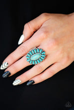 Load image into Gallery viewer, Refreshing turquoise stones are pressed into a studded silver frame, coalescing into a whimsical floral centerpiece atop the finger. Features a stretchy band for a flexible fit. Sold as one individual ring.
