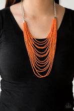 Load image into Gallery viewer, Row after row of vivacious orange seed beads cascade down the chest, creating summery layers. Features an adjustable clasp closure.  Sold as one individual necklace. Includes one pair of matching earrings.
