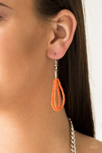 Load image into Gallery viewer, Orange seed bead circle hanging from a silver fish hook earring.
