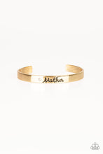 Load image into Gallery viewer, A sleek gold cuff wraps around the wrist in a casual fashion. Dotted with a dainty white rhinestone, the shimmery cuff is engraved in the word “Mother” for a loving finish.  Sold as one individual bracelet.
