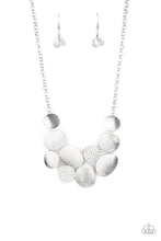 Load image into Gallery viewer, Featuring imperfect oval shapes, a series of delicately scratched and white rhinestone encrusted frames connect into a clustered pendant below the collar for a refined flair. Features an adjustable clasp closure. Includes one pair of matching earrings.
