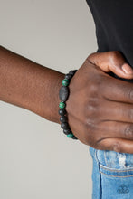 Load image into Gallery viewer, A collection of black lava rocks and earthy green stone beads are threaded along a stretchy band around the wrist for a seasonal look. Sold as one individual bracelet.
