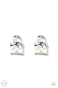 A row of glittery white rhinestones lines the edge of a curved silver frame featuring airy cutouts. Earring attaches to a standard clip-on fitting. Sold as one pair of clip-on earrings.