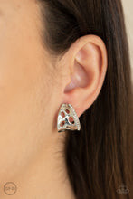 Load image into Gallery viewer, A row of glittery white rhinestones lines the edge of a curved silver frame featuring airy cutouts. Earring attaches to a standard clip-on fitting. Sold as one pair of clip-on earrings.

