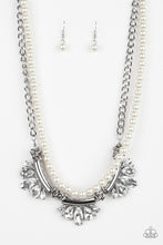 Load image into Gallery viewer, A classic strand of white pearls and dramatic silvery chain drape below the collar. Infused with heavy metal accents, teardrop and marquise cut white rhinestone frames connect into a show-stopping fringe. Features an adjustable clasp closure. Sold as one individual necklace. Includes one pair of matching earrings.
