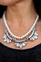 Load image into Gallery viewer, A classic strand of white pearls and dramatic silvery chain drape below the collar. Infused with heavy metal accents, teardrop and marquise cut white rhinestone frames connect into a show-stopping fringe. Features an adjustable clasp closure. Sold as one individual necklace. Includes one pair of matching earrings.
