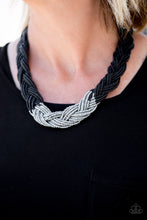 Load image into Gallery viewer, Strands of black seed beads create an indigenous braid below the collar. The black seed beads gradually morph into metallic silver beads at the center for a chic contrasting look. Features an adjustable clasp closure. Sold as one individual necklace. Includes one pair of matching earrings.
