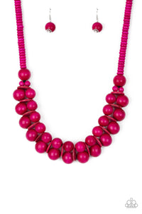 Brushed in a distressed finish, vivacious pink wooden beads and discs join below the collar for a summery look. Features a button loop closure.  Sold as one individual necklace. Includes one pair of matching earrings.