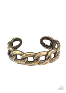 Brushed in an antiqued shimmer, oversized brass chain links boldly connect into a gritty cuff around the wrist.  Sold as one individual bracelet.