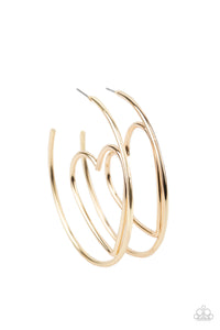 Shiny gold wire delicately bends into an airy heart frame inside a classic gold hoop, creating a flirtatious display. Earring attaches to a standard post fitting. Hoop measures approximately 2" in diameter. Sold as one pair of hoop earrings.