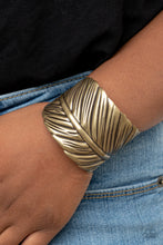 Load image into Gallery viewer, Embossed in life-like texture, an antiqued brass feather delicately curls around the wrist, creating a whimsical cuff.  Sold as one individual bracelet.
