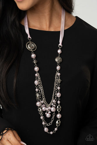 A silky pink ribbon replaces a traditional chain to give an elegant look. Pearly pastel pink beads and funky silver pieces intermix with varying lengths of silver chains to give a fresh take on a Victorian-inspired piece.  Sold as one individual necklace. Includes one pair of matching earrings.