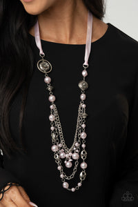 A silky pink ribbon replaces a traditional chain to give an elegant look. Pearly pastel pink beads and funky silver pieces intermix with varying lengths of silver chains to give a fresh take on a Victorian-inspired piece.  Sold as one individual necklace. Includes one pair of matching earrings.