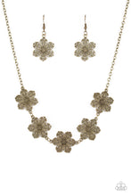 Load image into Gallery viewer, Featuring filigree filled petals, glistening brass flowers link below the collar in a seasonal fashion. Features an adjustable clasp closure. Includes one pair of matching earrings.
