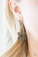 Load image into Gallery viewer, A filigree filled, glistening brass flower, adorns a brass fish hook earring.
