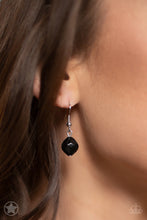 Load image into Gallery viewer, Black bead hanging from a silver fish hook earring.

