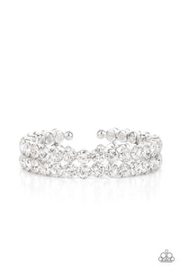 Encased in sleek silver fittings, two oversized rows of glassy white rhinestones stack into a blinding cuff around the wrist for a jaw-dropping look.  Sold as one individual bracelet.