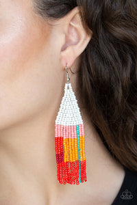 Featuring white, pink, blue, orange, and red seed beads, dainty beaded tassels swing from a beaded triangular frame for a colorful tribal look. Earring attaches to a standard fishhook fitting.  Sold as one pair of earrings.