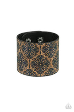 Load image into Gallery viewer, Painted in a regal blue floral pattern, a thick cork-like leather band wraps around the wrist for a statement-making look. Features an adjustable snap closure.  Sold as one individual bracelet.
