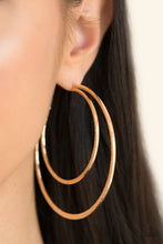 Load image into Gallery viewer, Featuring diamond-cut textures, two glistening gold bars curl into a bold hoop for a flawless finish. Earring attaches to a standard post fitting. Hoop measures 2 3/4” in diameter. Sold as one pair of hoop earrings.
