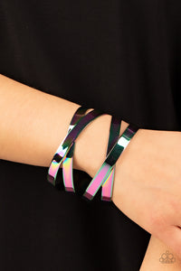 Industrial Imagination Bracelet - Burnished in a sleek oil spill finish, two sets of flat metal bands criss-cross over the wrist as they wrap into a lustrous cuff giving off an industrial vibe.