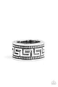 A thick silver band is studded and embossed in a tribal inspired pattern for an edgy look. Features a stretchy band for a flexible fit.  Sold as one individual ring.