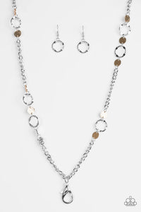 Delicately hammered in shimmery textures, glistening gold discs and abstract silver hoops trickle along a bold silver chain for a fierce industrial look. A lobster clasp hangs from the bottom of the design to allow a name badge or other item to be attached. Features an adjustable clasp closure.  Sold as one individual lanyard. Includes one pair of matching earrings.