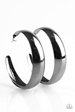 Load image into Gallery viewer, A thick ribbon of glistening gunmetal curls into a dramatic hoop for a bold industrial look. Earring attaches to a standard post fitting. Hoop measures 2 1/2” in diameter.  Sold as one pair of hoop earrings.
