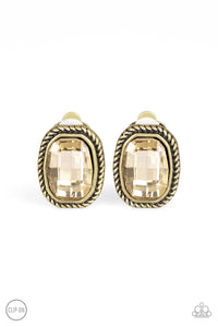 Faceted topaz gems are pressed into textured brass frames for a refined look. Earring attaches to a standard clip-on fitting.  Sold as one pair of clip-on earrings.