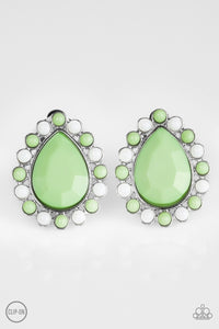 Dainty white and green beads spin around a faceted green teardrop, creating a colorful frame. Earring attaches to a standard clip-on fitting.  Sold as one pair of clip-on earrings.