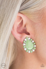 Load image into Gallery viewer, Dainty white and green beads spin around a faceted green teardrop, creating a colorful frame. Earring attaches to a standard clip-on fitting.  Sold as one pair of clip-on earrings.

