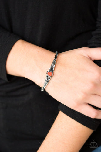 Infused with an earthy orange stone center, a dainty silver cuff has been embossed in swirling antiqued detail for a seasonal look.  Sold as one individual bracelet.